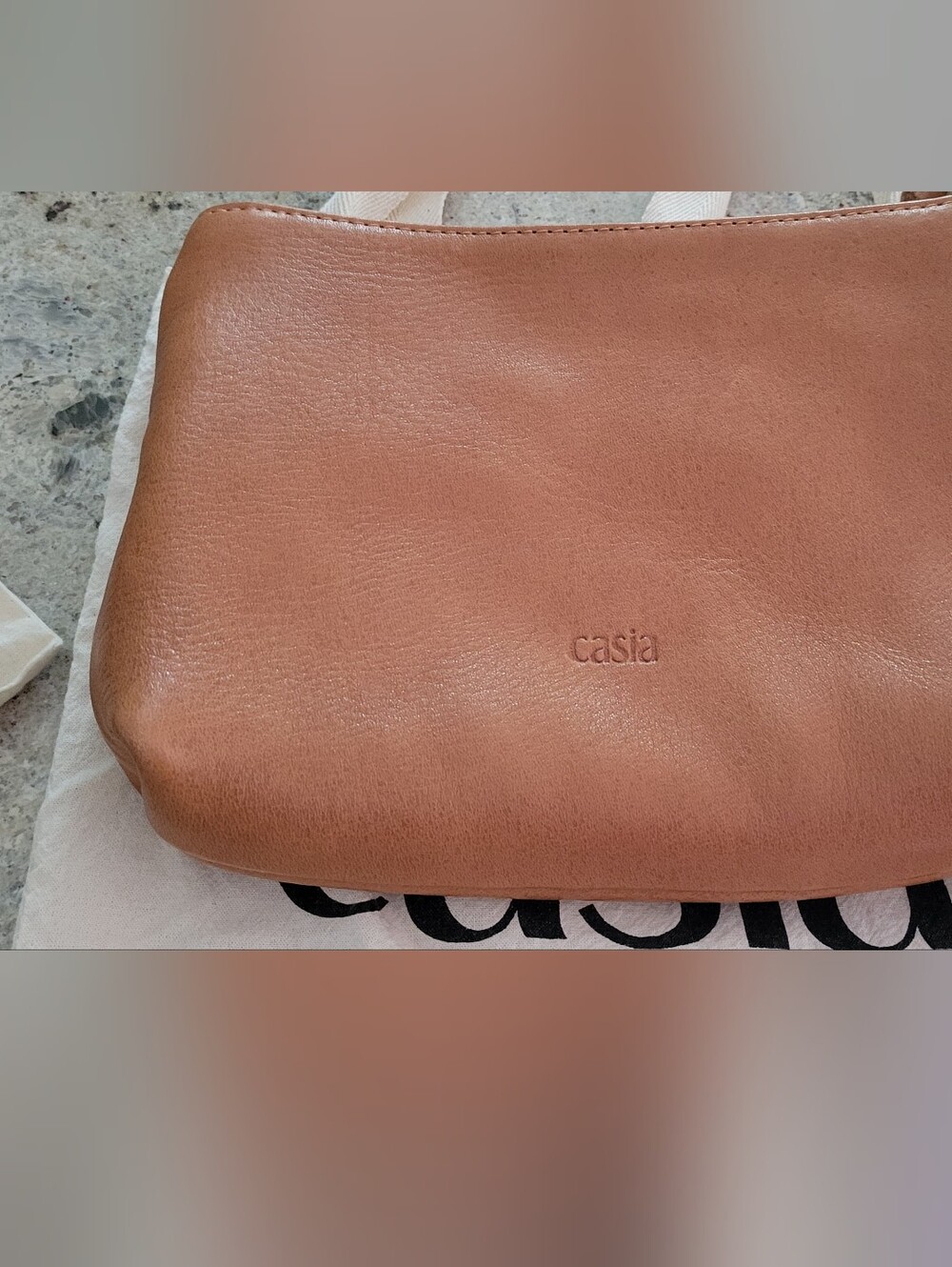 Casia Tan Leather Clutch Bag